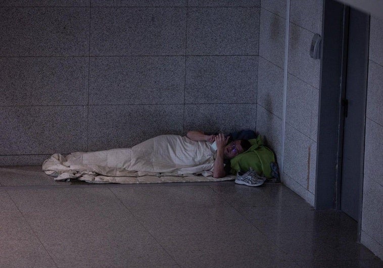 A homeless person in a corner of T3 at Malaga airport.